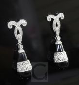 A modern pair of 1920's style 14ct white gold, black onyx and diamond set pear shaped drop earrings,