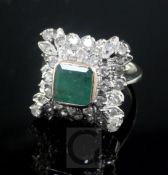 A 19th century style white gold, emerald and diamond cluster ring, of square form with raised