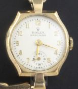 A lady's 1940's 9ct gold Rolex Precision manual wind wrist watch, with shaped hexagonal case and