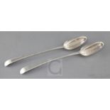 A pair of George III silver feather edge Old English pattern straining spoons, maker, WT?, London,