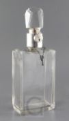 A George V silver mounted plain glass lockable decanter by Asprey & Co Ltd, of rectangular form,