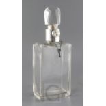A George V silver mounted plain glass lockable decanter by Asprey & Co Ltd, of rectangular form,