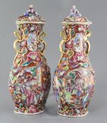 A pair of Chinese famille rose 'Mandarin' vases and covers, Qianlong period, each of quatrelobed