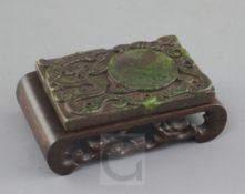 A Chinese green hardstone rectangular brushwasher, carved in high relief with a dragon amid