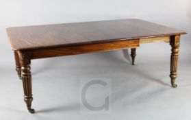 A Victorian mahogany extending dining table, with rounded rectangular top and three leaves, on