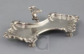 A George II silver waisted snuffers stand by William Gould, with flying scroll handle and engraved