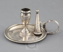 A George III silver circular chamberstick by William Bateman, with engraved armorial and matching