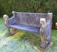 An Empire style reconstituted stone garden bench, with stylised leopard monopodia, 5ft 5.5in.