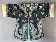 A Chinese black satin robe, 19th century, decorated in Peking knot and satin stitch embroidery