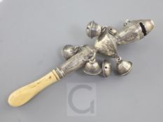 A 19th century ivory handled silver child's rattle, with six bells and engraved decoration, maker'