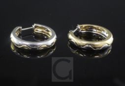 A pair of Cartier 18ct two colour gold hoop earrings, signed and numbered 569200.