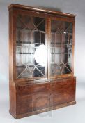 A George III mahogany straight front library bookcase, with fluted freize and two astragal glazed