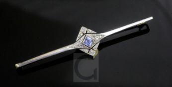 A late 1920's gold and platinum, sapphire and diamond set bar brooch, with central star motif,