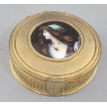 A late 19th century Palais Royale ormolu casket, inset with a Limoges enamel plaque of a lady,