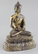 A Chinese gilt bronze seated figure of Buddha Shakyamuni, holding an incense burner and seated