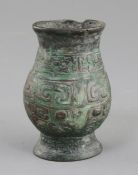 A small Chinese archaic bronze ritual wine cup, Zhi, Western Zhou dynasty, 11th century B.C., cast