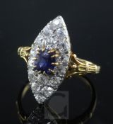 A gold, sapphire and diamond marquise shaped dress ring, with pierced shoulders and reeded shank,