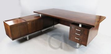 A 1960's Jorgen Pedersen Danish rosewood L shaped desk, fitted with an arrangement of drawers and