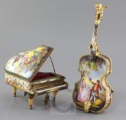 Two 20th century Viennese enamel musical boxes, in the form of a piano and a cello with stand, 6.