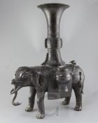 A massive Chinese bronze elephant-form censer, Ming dynasty, with standing caparisoned elephant