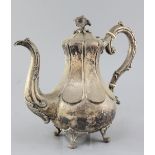 A 19th century Swedish silver pear shaped coffee pot with floral finial, on four scroll feet,