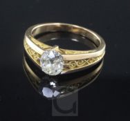 A yellow metal (tests as 14ct) and solitaire oval cut diamond ring, the stone weighing approximately