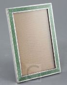 An early 20th century continental silver and two colour enamel mounted rectangular photograph frame,