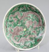 A Chinese Susancai 'dragon' saucer dish, Kangxi mark and of the period (1662-1722), the interior and