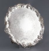 A William IV silver shaped circular salver, by William Brown, with engraved decoration and shell