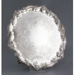 A William IV silver shaped circular salver, by William Brown, with engraved decoration and shell