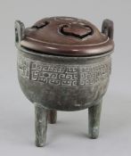 A Chinese archaistic bronze tripod vessel, Ding, Qing dynasty, cast in relief with a band of