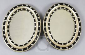 A pair of Regency Irish ebonised and silvered wall mirrors, decorated with facetted pastes, H.