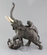 A large Japanese bronze group of tigers attacking an elephant, Meiji period, with ivory tusks, three