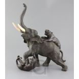 A large Japanese bronze group of tigers attacking an elephant, Meiji period, with ivory tusks, three