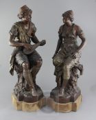 A pair of late 19th century French bronzed spelter figures of Arab musicians, height 21in.