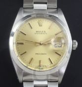 A gentleman's 1970's stainless steel Rolex Oysterdate precision manual wind wrist watch, with yellow