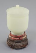 A Chinese pale celadon jade jar and cover, 19th / early 20th century, of plain form, the domed cover