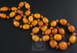 A single strand graduated amber bead necklace, with amber disc spacers, gross weight 190 grams,