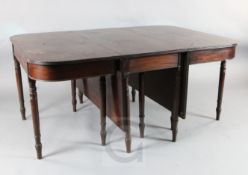 A Regency mahogany dining table, with two D shaped ends and central dropleaf, on turned legs, L.