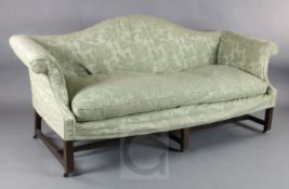 A George III mahogany camel back scroll arm settee, with squared legs, all-round stretchers and