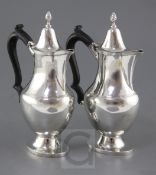 A pair of George V silver hot water or cafe au lait pots by Nathan & Hayes, of ovoid baluster