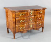 An 18th century Continental walnut commode fitted three serpentine drawers W.3ft9in. D.2ft. H.