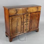 A George III mahogany side cabinet, with rising flap to the front enclosing a drawer and four