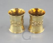 A good pair of late 1920's 18ct gold napkin rings by Edward Barnard & Sons Ltd, of waisted form