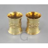 A good pair of late 1920's 18ct gold napkin rings by Edward Barnard & Sons Ltd, of waisted form