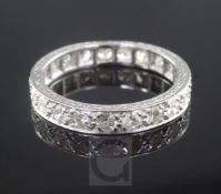 A platinum and diamond full eternity ring, set with twenty one round cut stones, size N.