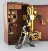 A Henry Crouch compound binocular microscope, early 20th century, serial number 4459, with 11