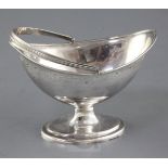 A George III silver bright cut oval boat shaped pedestal sugar basket, by William Abdy II, London,