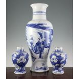 A large Chinese blue and white vase and two baluster jars, 18th century and later, the tall vase