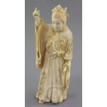 A Japanese ivory figure of a courtier, Meiji period, signed Masatoshi, clutching a sword in his left